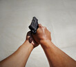 Hands, pov and man with gun against white background for target, practice or training on mockup. Space, weapon and security guard with firearm for shooting, legal or protection from crime or danger