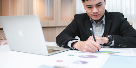 Wall Mural - confident businessman wearing glasses signing contract at group negotiations, business partners making successful investment deal, agreement, salesman putting signature on legal documents