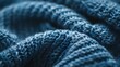 Closeup view of the blue colored texture of a woolen cloth
