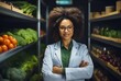 woman with arms crossed in the middle of vegetables