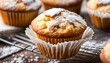 © JohnLee - Fresh homemade delicious vanilla muffins with powdered sugar.