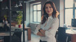 © Generative AI - Proud arms crossed and confident businesswoman standing alone in a modern office Young female business owner smiling in a corporate workplace Happy and successful lady at work with cop : Generative AI