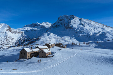 Wall Mural - The Simplon Pass, snowy with the peaks of the Lepontine Alps and the small village of 