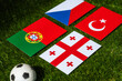 Football Tournament in Germany 2024: Group F and national flags of Turkey, Georgia, Portugal, Czech Republic and soccer ball on green grass