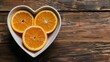 Heart Shaped Bowl Filled With Oranges on Wooden Table