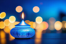 Burning Candle In Blue Candlestick Background. Vesak Day Concept