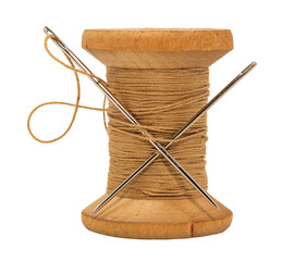 Wall Mural - Old wooden spool of thread and needle on a white background. Sewing accessories