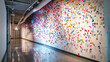 A long hallway with a colorful confetti wall mural.