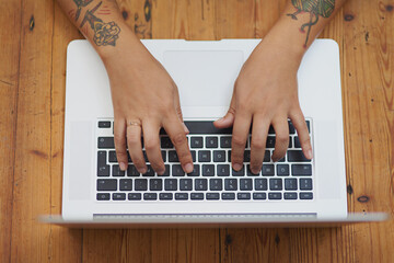 Hands, students and laptop for online research, planning and e learning resources to view or angle at desk. Person editing PhD proposal on computer for scholarship, essay or assignment with keyboard
