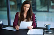 © peopleimages.com - Paperwork, reading and business woman in office with pen for job promotion, onboarding or recruitment. Contract, career and female financial advisor with signature for company insurance document.