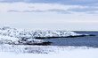snow covered seaside shore in Vardo, Norway