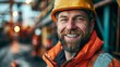 © Art_You - Smiling construction worker in hard hat and high-visibility jacket on industrial site