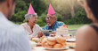 © peopleimages.com - Senior, couple and happy with video call at birthday party for celebration, laughing and memories in garden. Elderly, man and woman with smartphone for photography, gathering and event in backyard