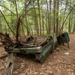 Abandoned vehicle flipped years ago in the woods