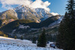Polana Chocholowska in winter sunny day, Western Tatra Mountains, Poland. The valley and old wooden huts covered in snow