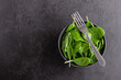 Fresh green spinach leaves in the bowl. Natural vegetarian food.