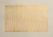 Gold bronze glitter ink watercolor wave line strip stain blot on beige grain paper texture background.