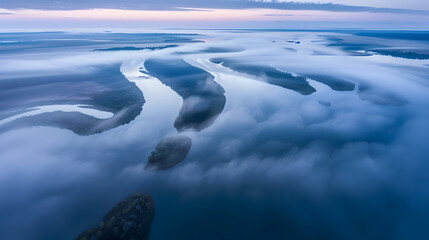Poster - A secluded river winding through a thick mist at dawn, captured with a wide-angle lens for a sweeping view