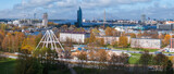 Fototapeta  - Construction of the observation wheel in Riga, Latvia. Beautiful ferris wheel in the Victory park in the center of Riga with a beautiful view of the old town.
