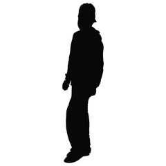 Wall Mural - A young man walking while wearing a hat in silhouette