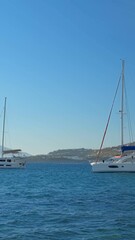 Wall Mural - Sunset in Mykonos island, Greece with yachts in the harbor and colorful waterfront houses of Little Venice romantic spot. Mykonos town, Greece. Horizontal camera pan