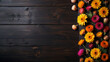 A wooden background with a colorful arrangement of flowers, view from above. Ai generated image.