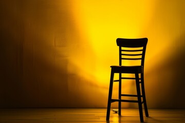 Canvas Print - Black chair on yellow background lamp spotlight on chair bar stool chair under stage light