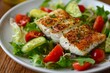 © LimeSky - Flaky white fish with seasoning on salad