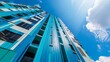 Captures the facade of a new condominium, painted in vibrant fresh blues that reflect the sky, creating a lively and inviting presence in the urban landscape