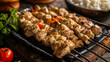 Grilled chicken skewers with vegetables on a black plate. Gourmet food and barbecue concept. Design for menu, recipe, and culinary arts. Close-up shot with selective focus.