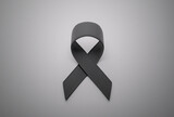 Fototapeta Tęcza - Skin cancer. Black ribbon as a symbol of skin cancer awareness. 3d render