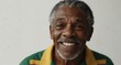 © sevenSkies - young jamaican elderly man on plain bright white background laughing hysterically looking at camera background banner template ad marketing concept from Generative AI