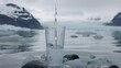   A glass of water atop a rock by a body of water Icebergs dot the background