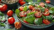   A tight shot of a bowl filled with tomatoes, spinach, onions, and assorted vegetables on a table