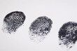 Three fingerprints on white background