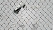 © Mark - Fences made of broken wire, rabitz or chain link. Modern background of ripped metal mesh, steel grid, net with hole in the center, damaged safety border, freedom concept.