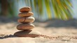   A pile of rocks balanced atop one another on a sandy beach, near a palm tree