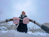 Fototapeta  - Father walks through the snowy landscape, child moment of seasonal joy.