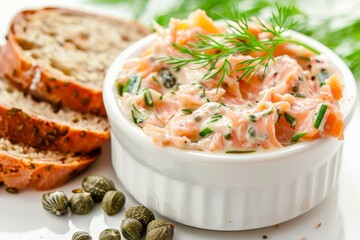 Canvas Print - salmon and cheese pate with bread and capers on white background