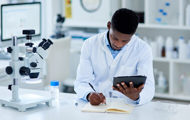 Science, researcher and black man writing, tablet and notes for experiment and test scores with connection. Laboratory, African person and expert with tech and online reading with review and feedback