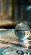 Macro photograph of a crystal clear globe resting on a financial newspaper, symbolizing global business strategies