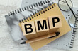 BMP Basic metabolic panel. craft notebook and gray notepad on the work table. text on blocks