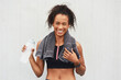 Black woman, athlete and water bottle in studio, portrait and hydrate after workout on white background. Female person, detox and mineral liquid for recovery after exercise, fitness and mockup space