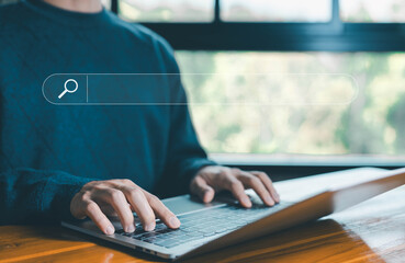Wall Mural - man using a laptop shows a search bar. concept of web browser information, keyword search engines, s