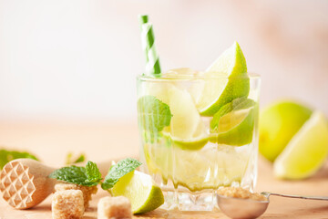 Wall Mural - Caipiroska cocktail with lime and mint in rocks glass