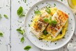 Creamed salt cod with polenta on white plate Italian dish top down view