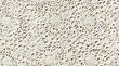 seamless texture of vintage crochet lace with a textured, handcrafted appearance in a cream or beige color