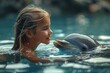 An engaging moment between a human and dolphin, with the face intentionally blurred in the reflective water