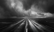 An empty road in the middle of the field in the style of boldly black and white, An empty highway with a dark sky in the background

