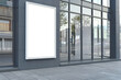 A blank white billboard on a modern building's exterior on an urban street, concept of advertising space. Generative AI